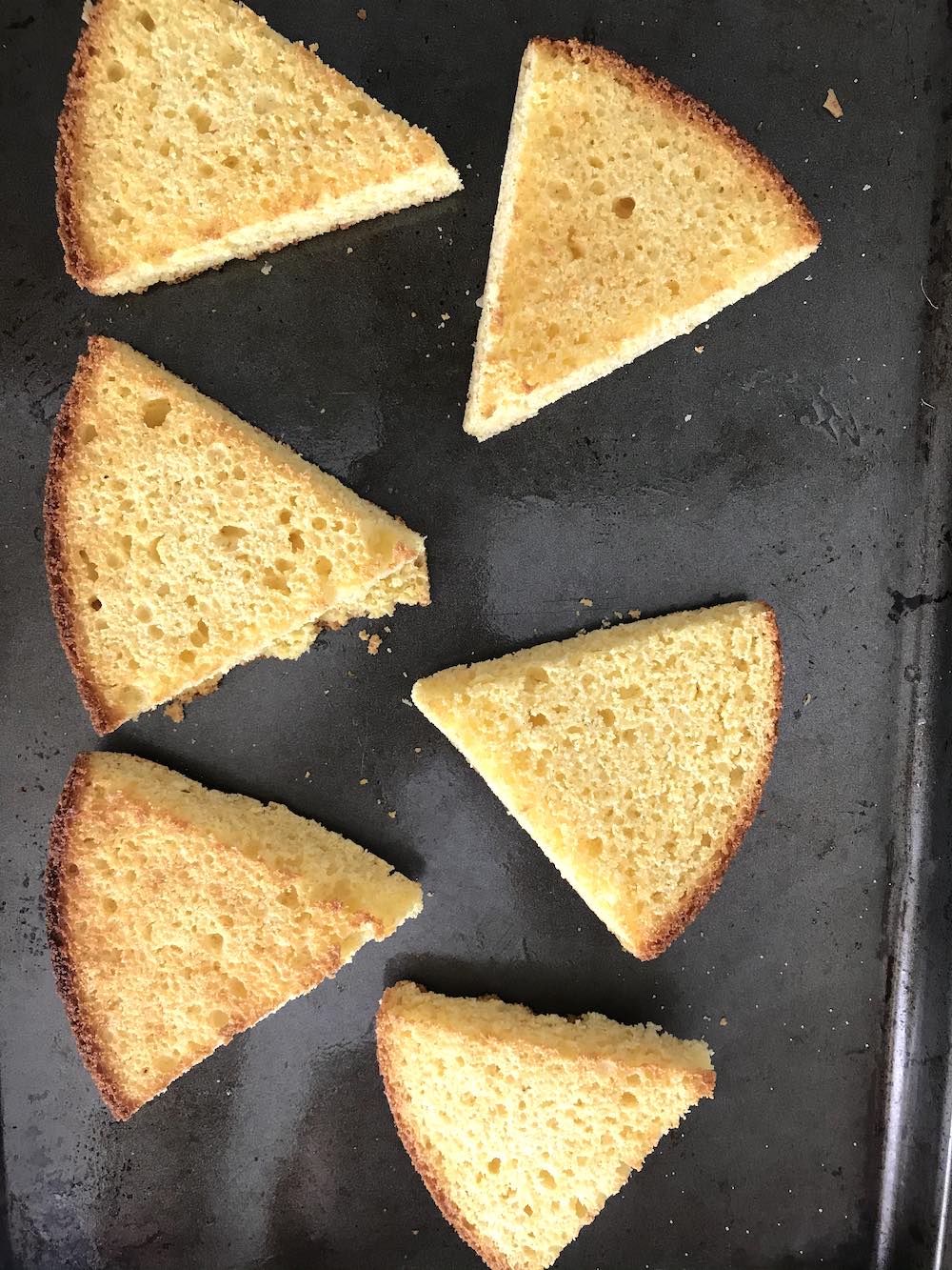 Cornbread toasted under a broiler until brown and crispy. 