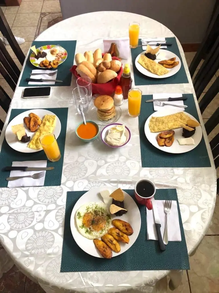 Typical desayuno chapin or Guatemalan breakfast on a white tablecloth.