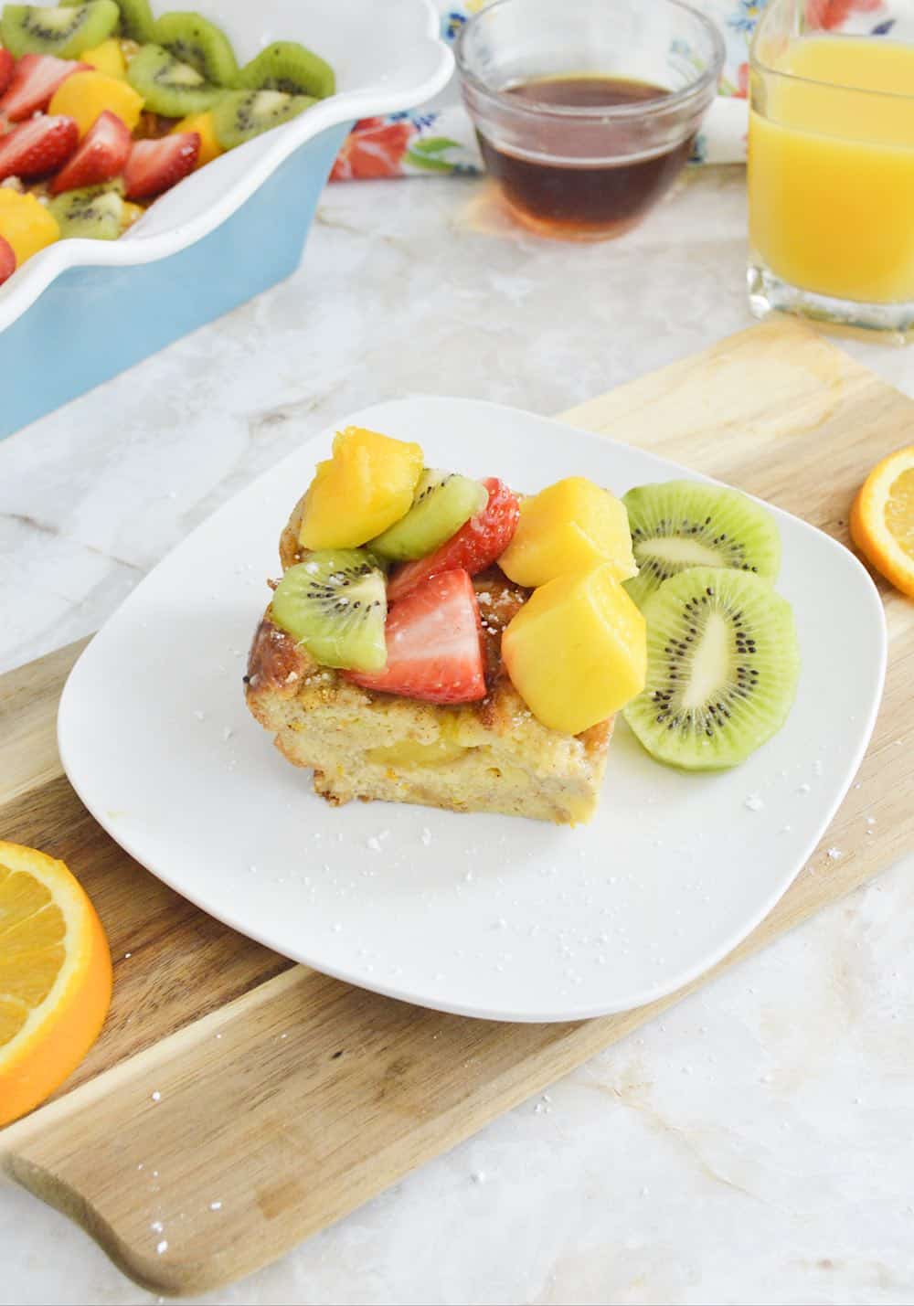 Portrait of serving of French Toast topped with fresh fruit.