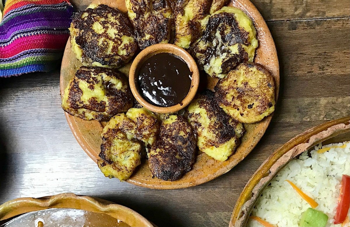 The famous Guatemalan dish of rellenitos de platano in a clay dish. 