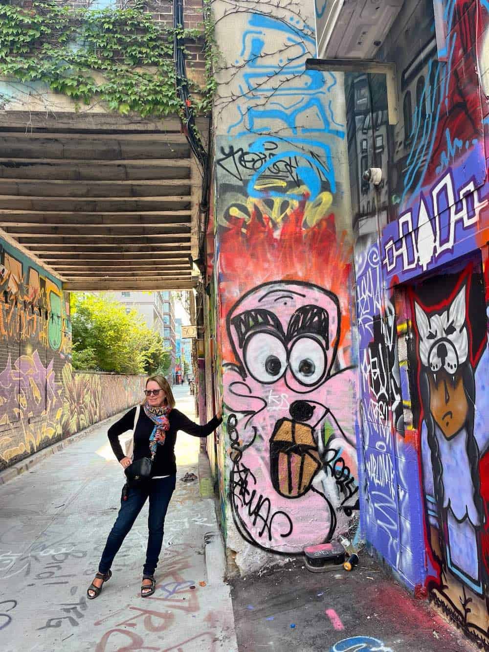 Food and travel writer Michele Peterson at Graffiti Alley in Toronto.