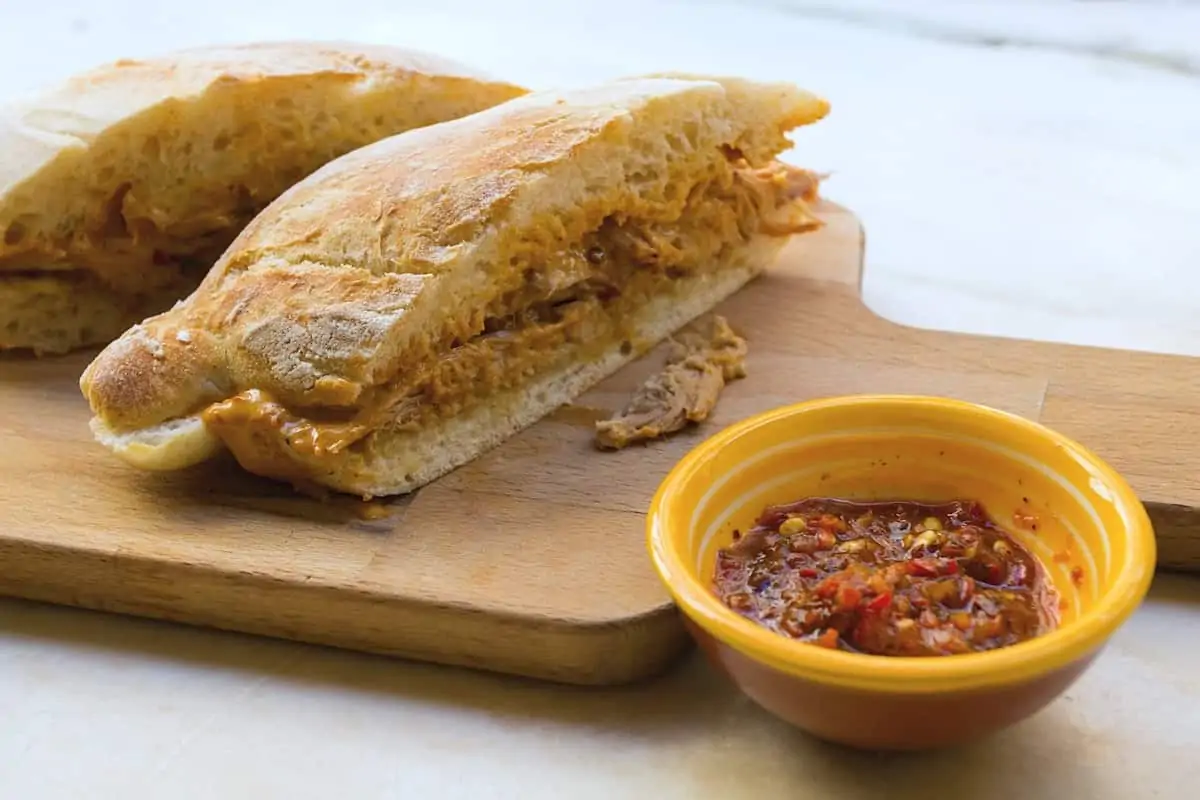 A traditional Portuguese food known as a bifana sandwich.