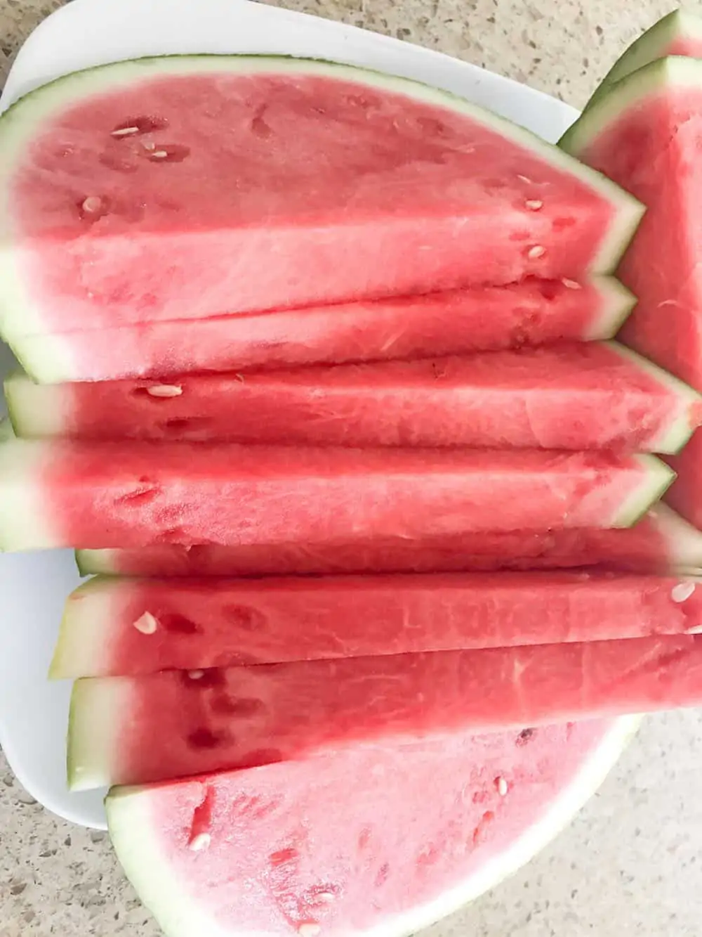 Slices of seedless watermelon on a plate.