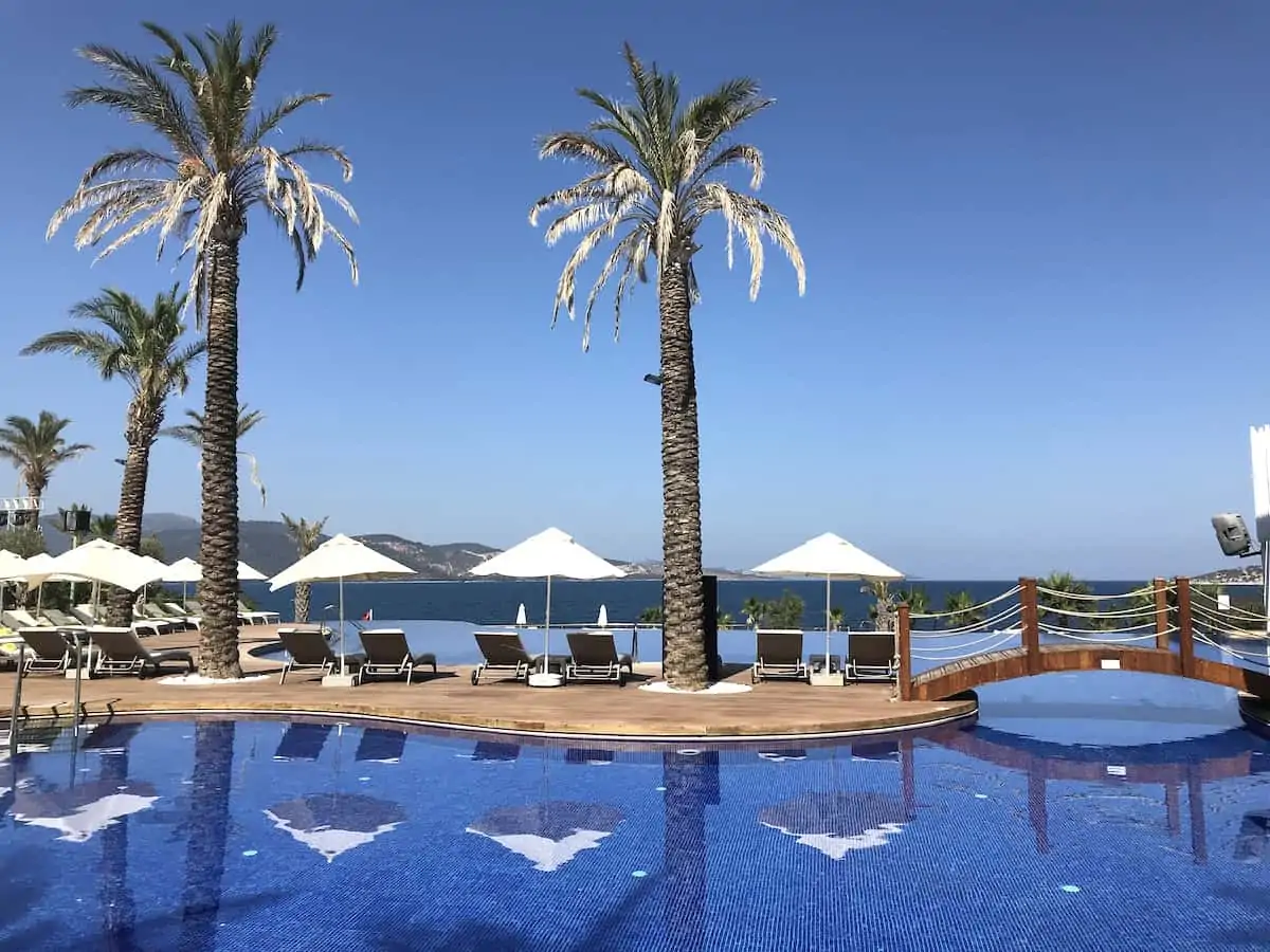 Palm trees and swimming pool at Be Premium luxury resort in Bodrum.