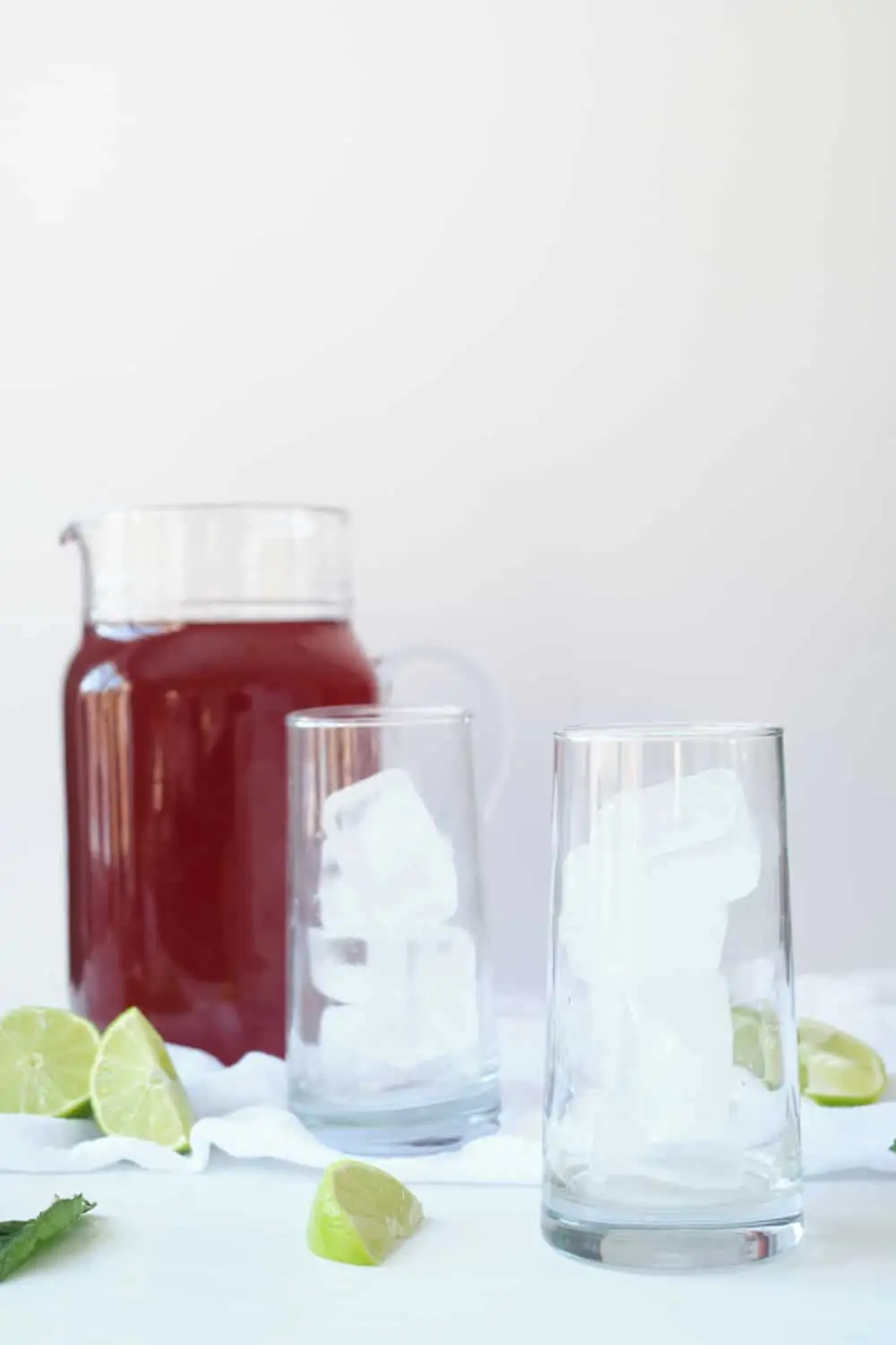 Cold brew hibiscus tea in a glass pitcher.