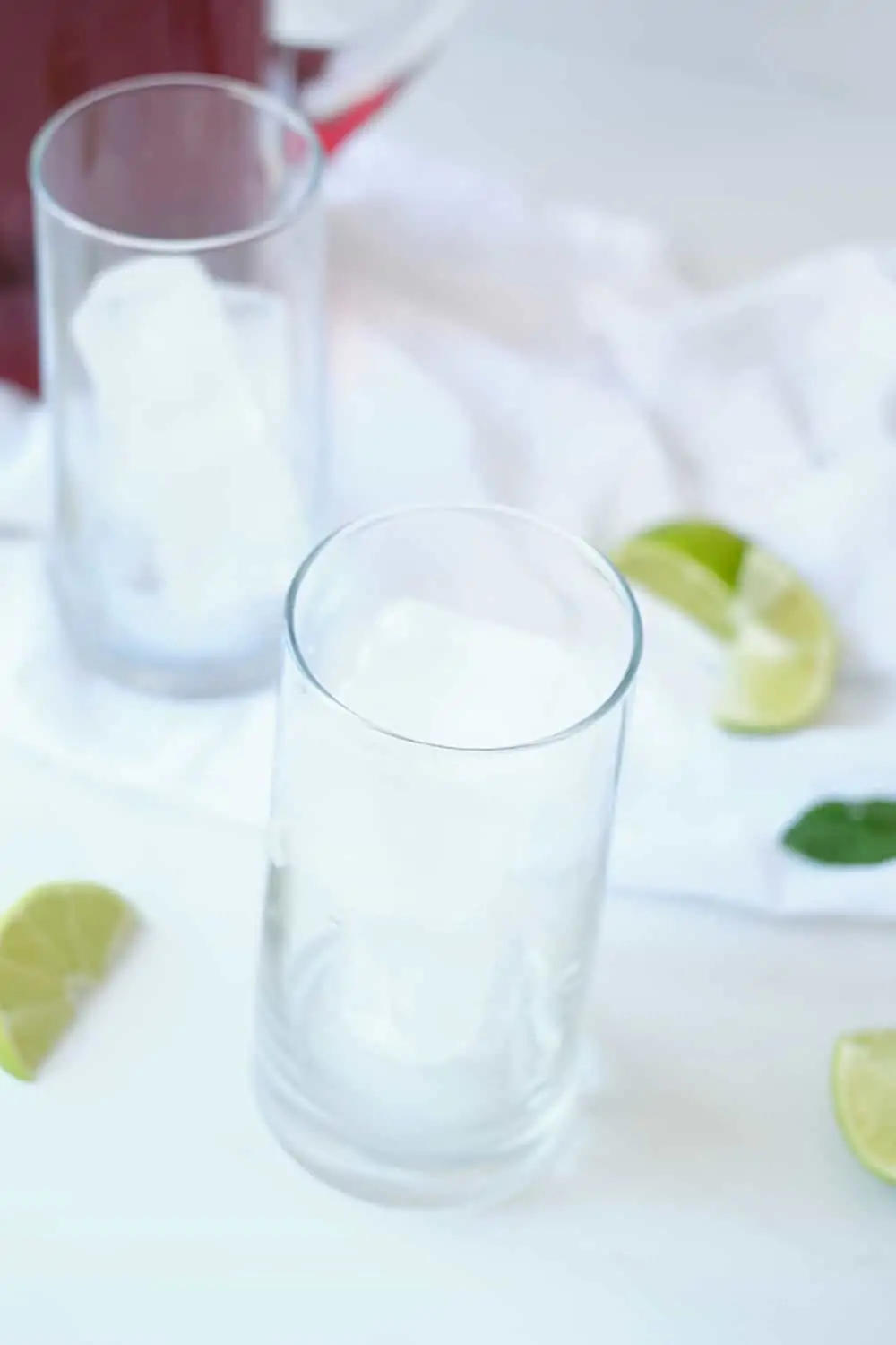 Ice cubes in tall glasses. 