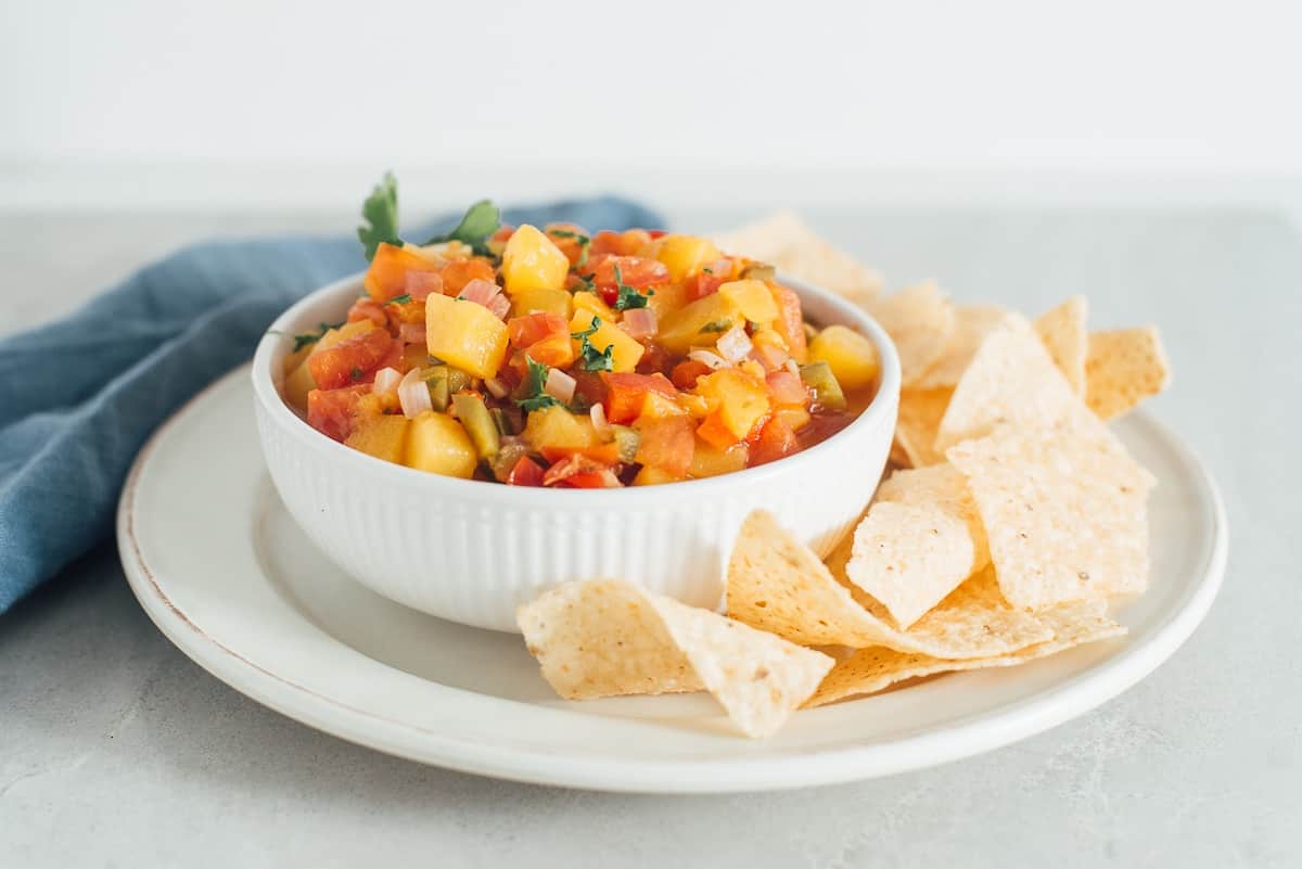 Fresh peach jalapeno salsa with tortilla chips.