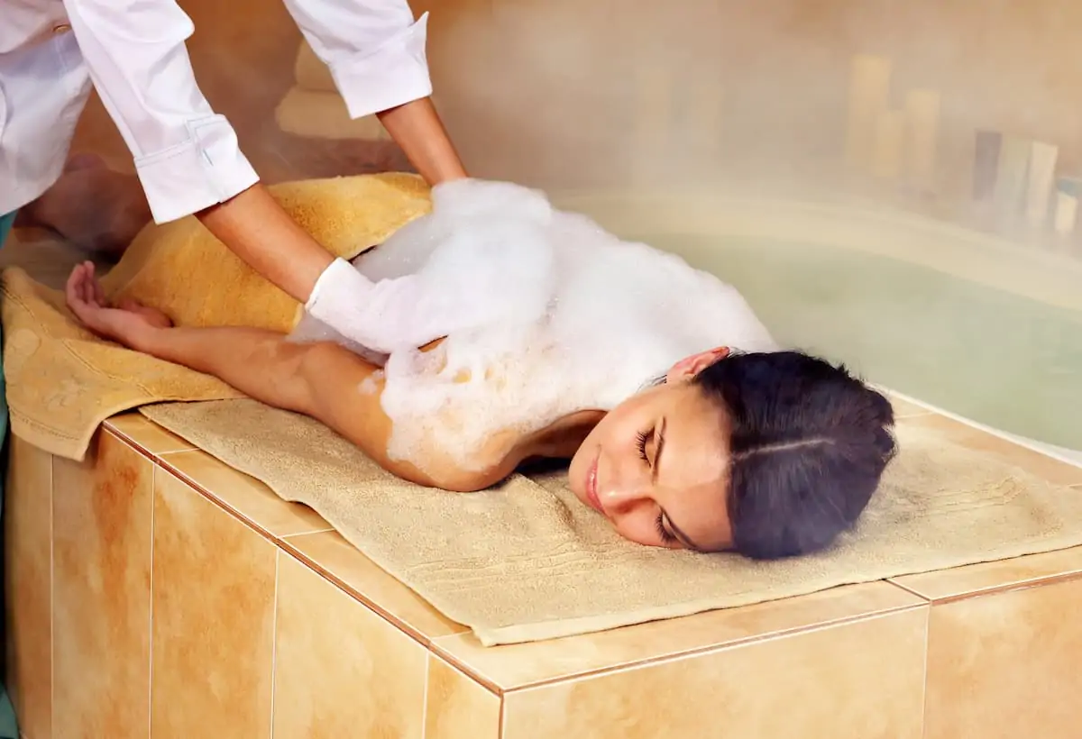 Woman in hammam or turkish bath. 