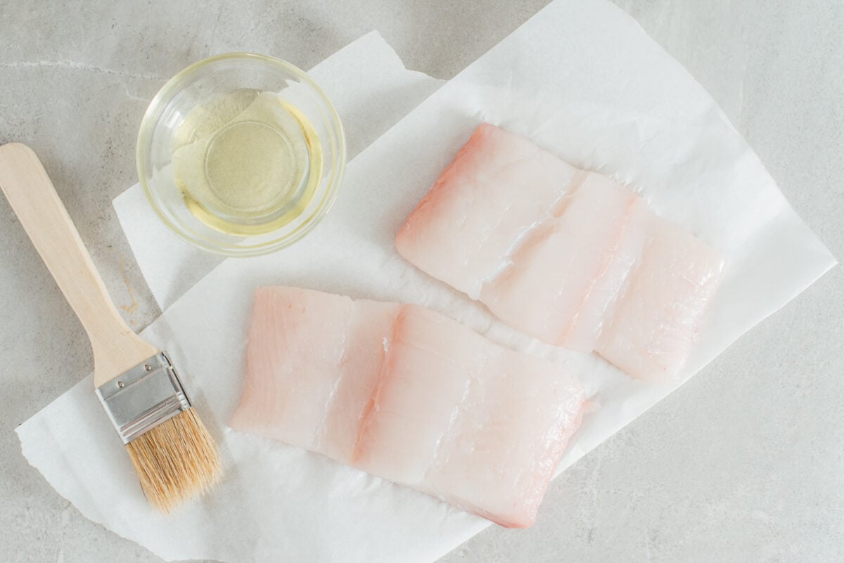 Two pieces of raw halibut.