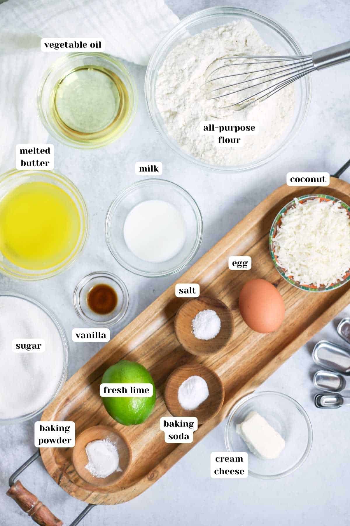Ingredients to make coconut lime cookies with text labels.