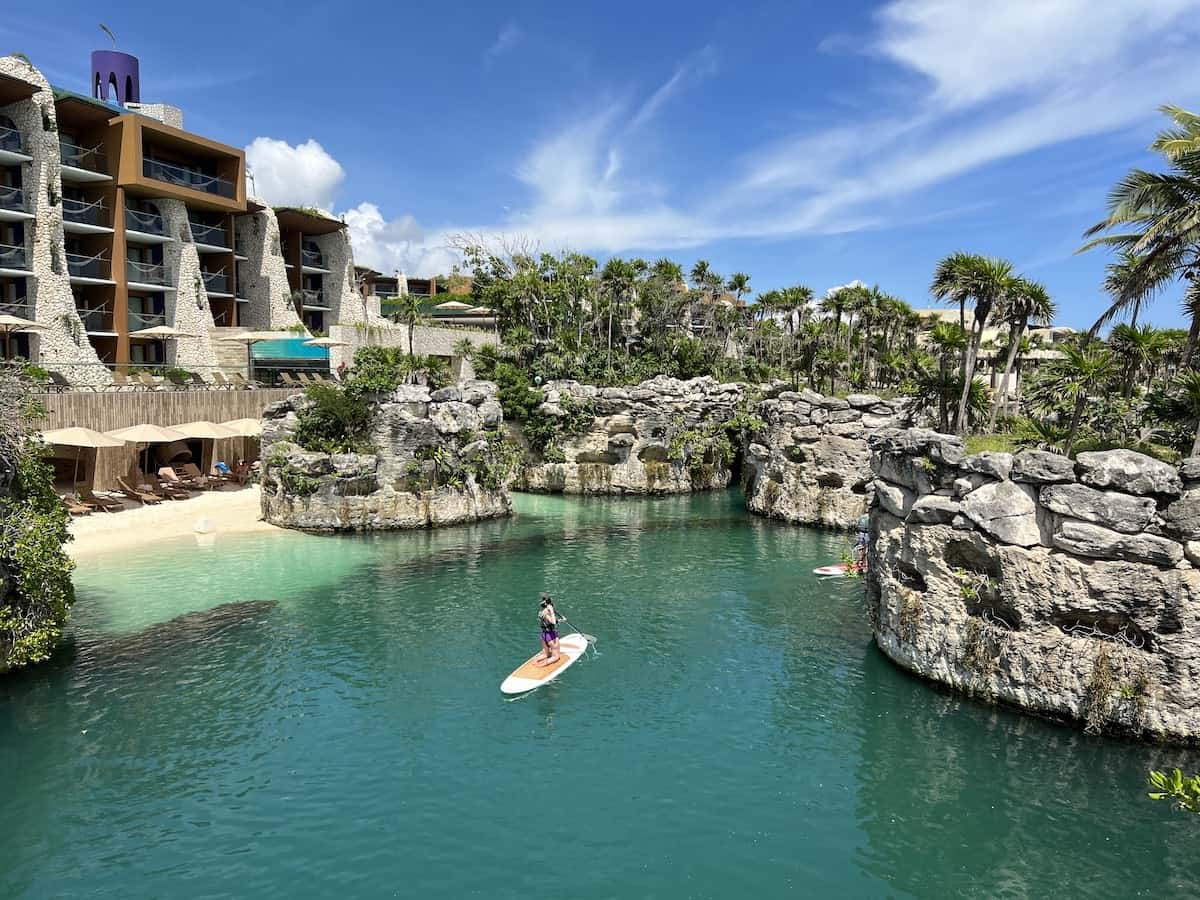 Woman paddleboarding at Hotel Xcaret Arte in Mexico.