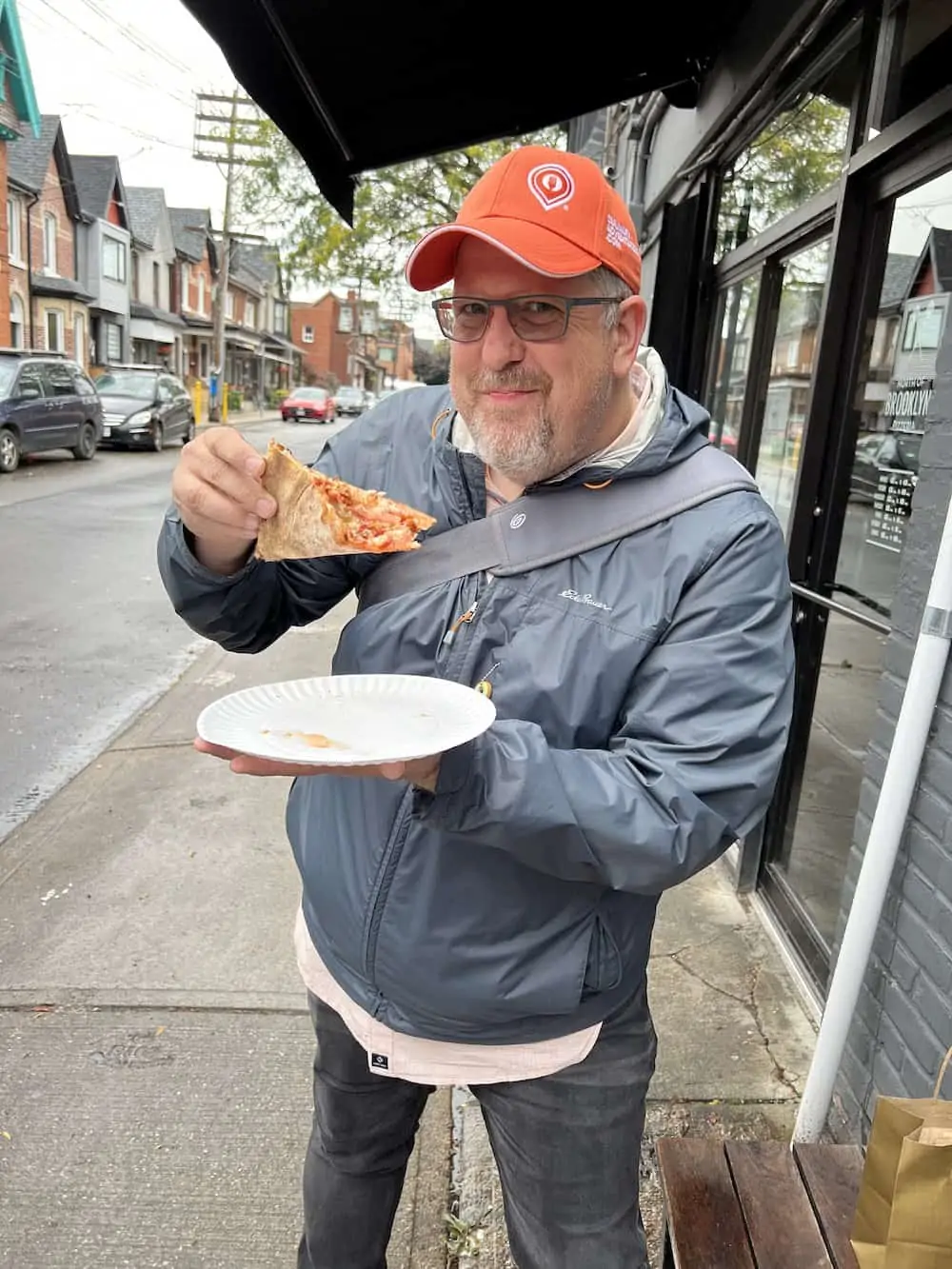 Kevin Durkee of Culinary Adventure Company with a piece of pizza.