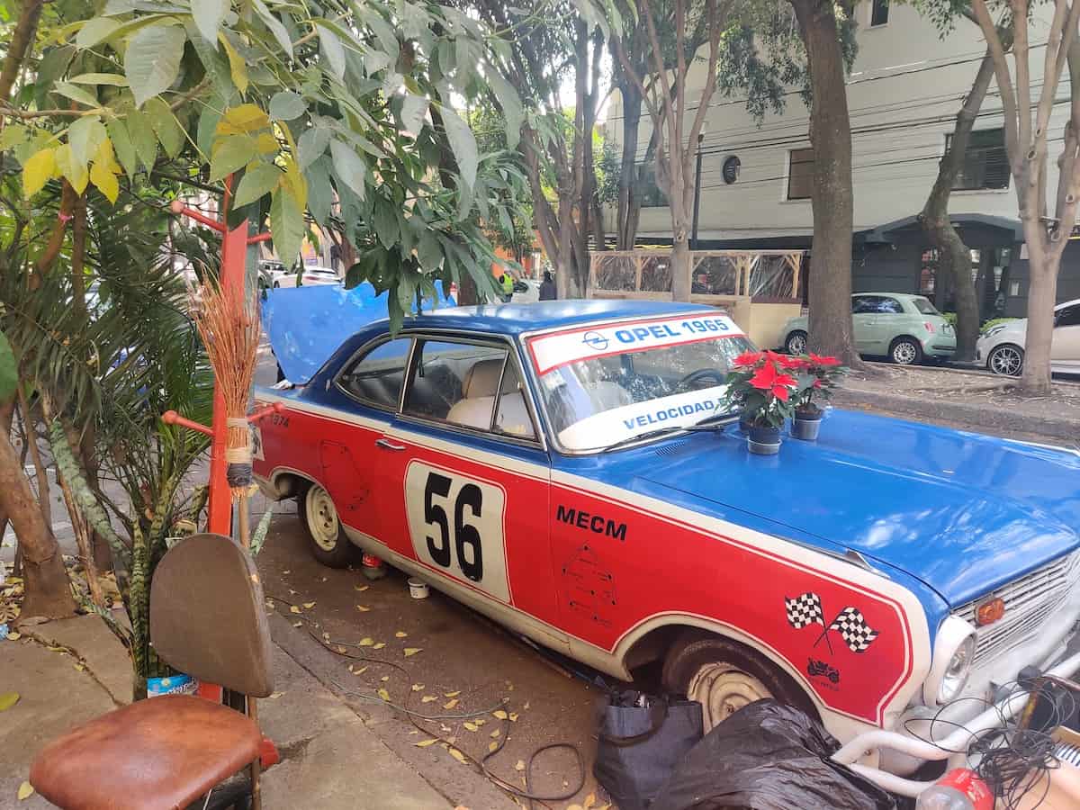 A vintage red car in Colonia Roma in Mexico City. Credit Talia Wooldridge