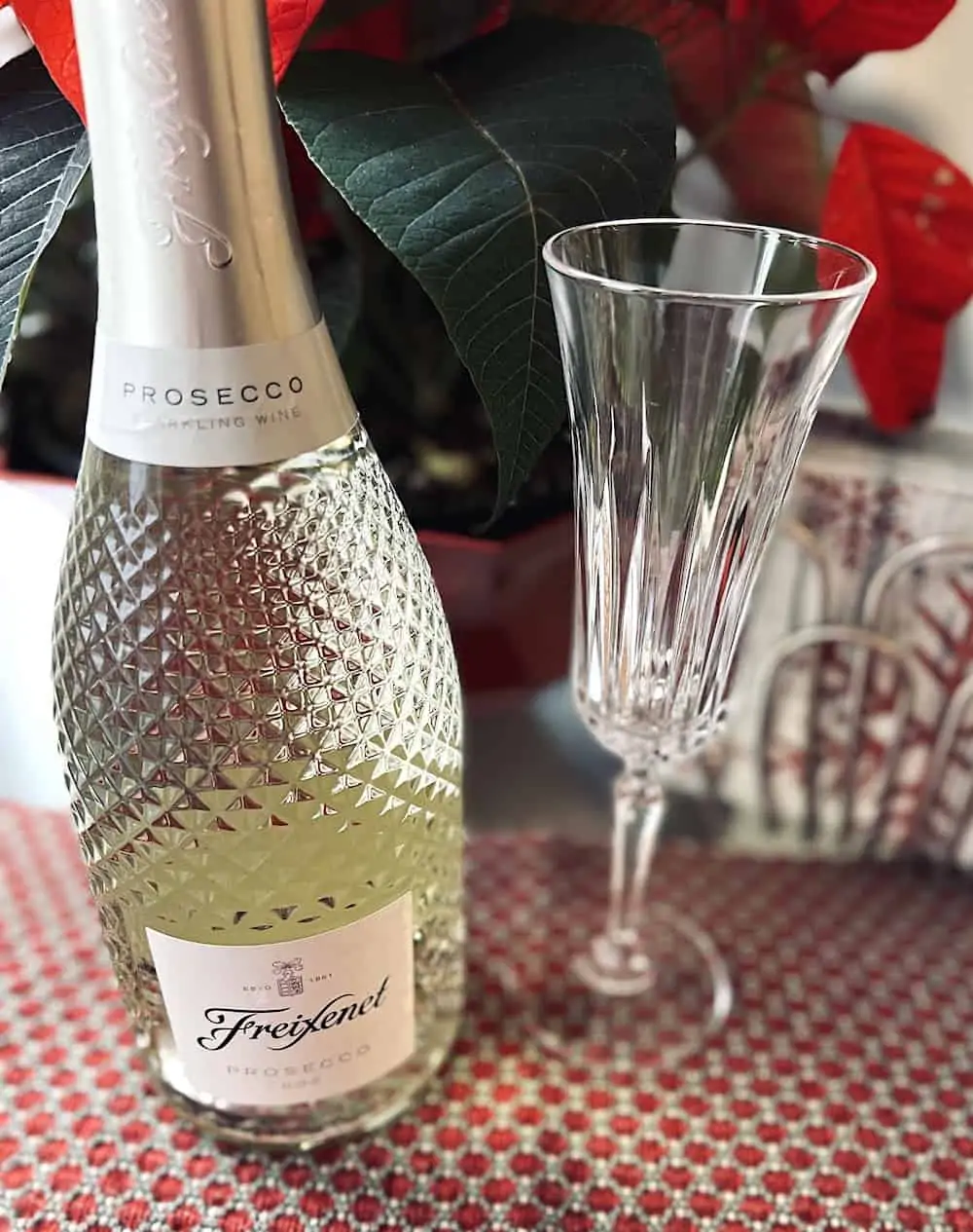 Bottle of Freixenet Spanish prosecco with a champagne glass.