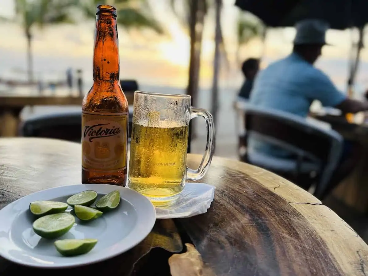 A glass of beer at a beach bar in Puerto Escondido Mexico.