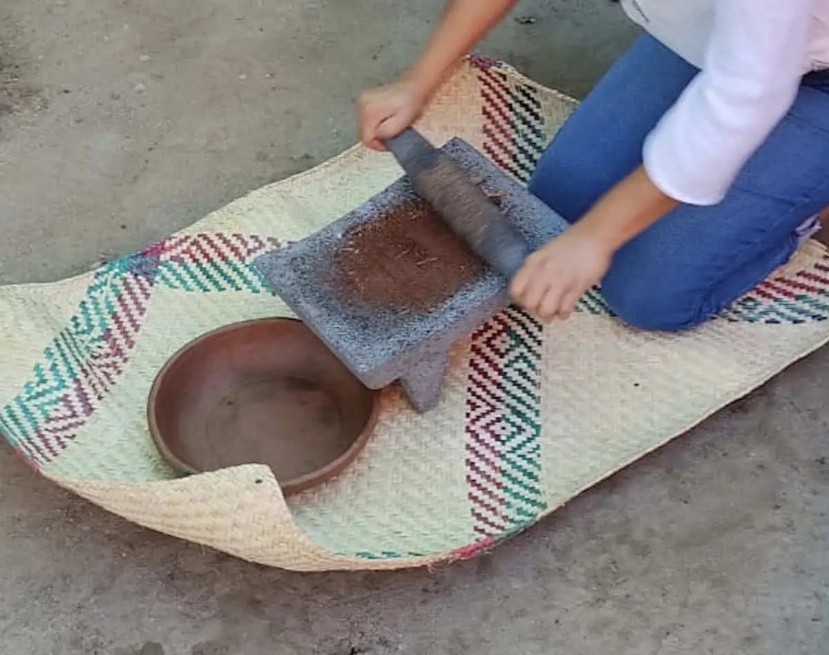 Grinding cacao by hand in Oaxaca. 