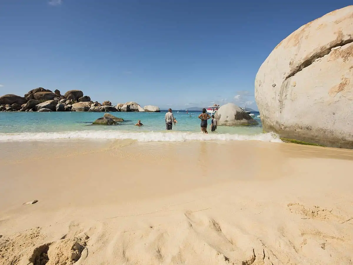 People swimming at The Baths in British Virgin Islands.