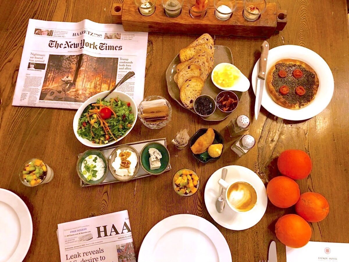 Newspaper and breakfast at Efendi Hotel in Israel.