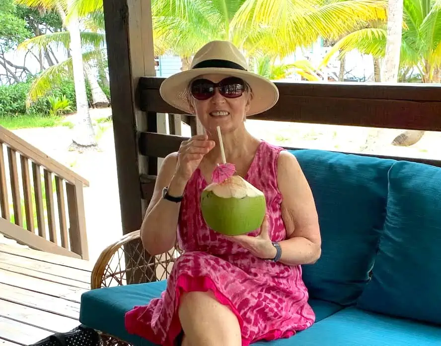 Travel writer Melody Wren with a cocktail in Belize.