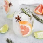 A grapefruit spanish gin and tonic on the table with grapefruit slice and star anise.