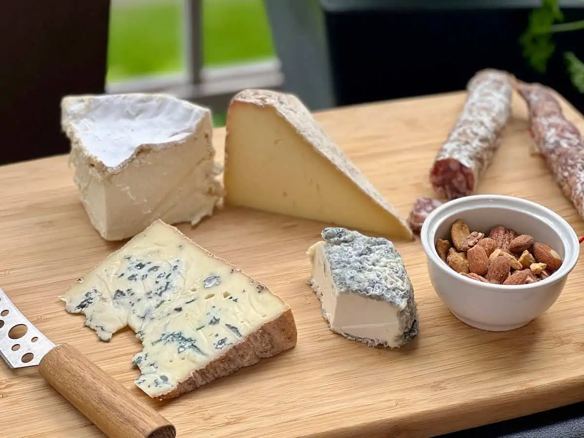 A selection of Quebec cheese and charcuterie on a wooden board