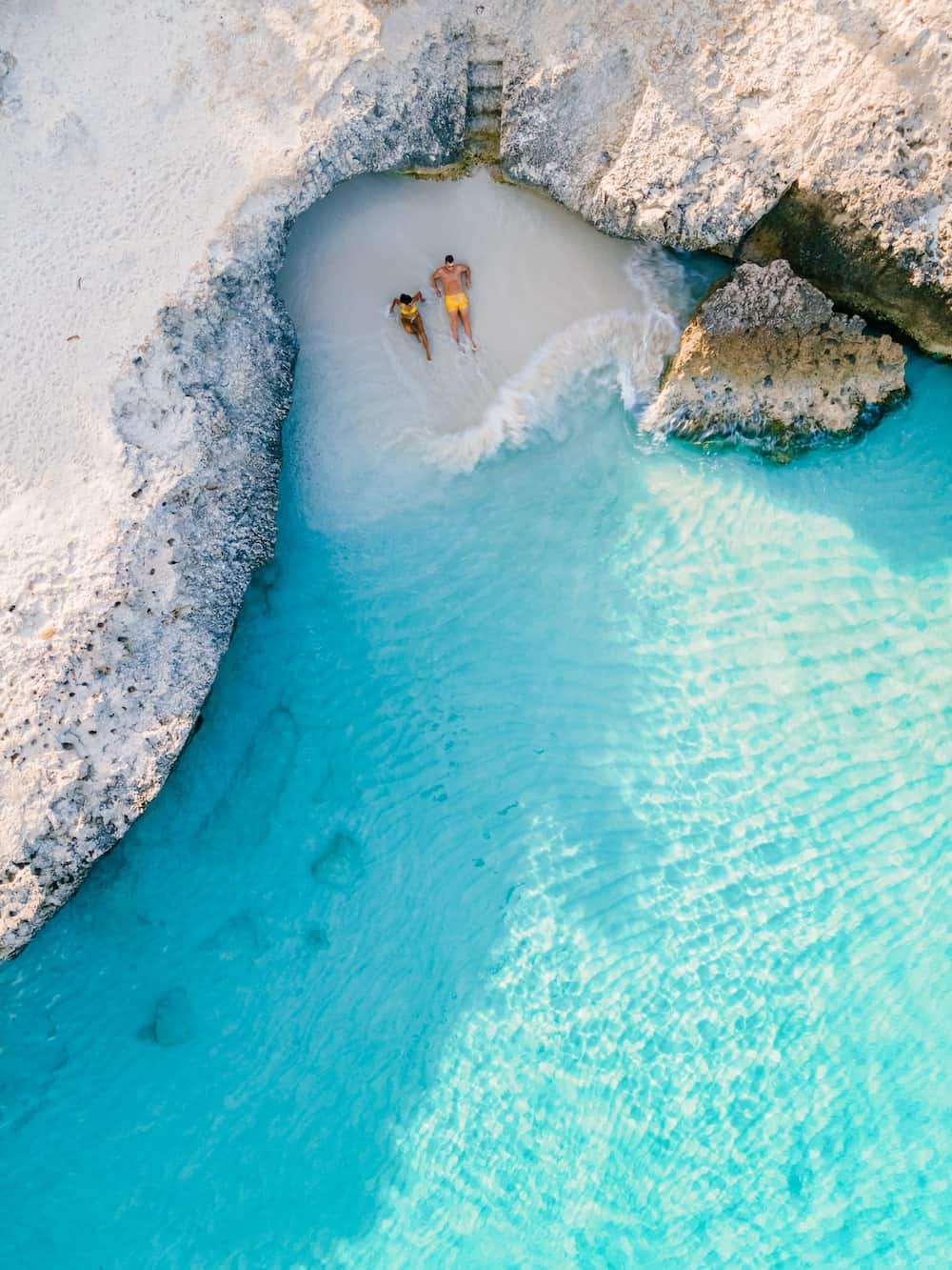 A couple on a secluded cove in Aruba.