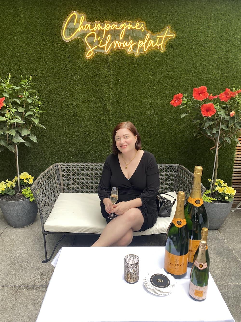 Woman sipping champagne at La Terrasse in Montreal. d