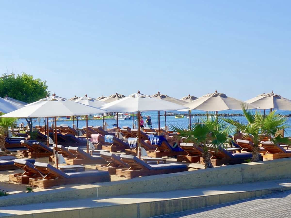 Sun beds and loungers at Alykes Beach in Paphos.