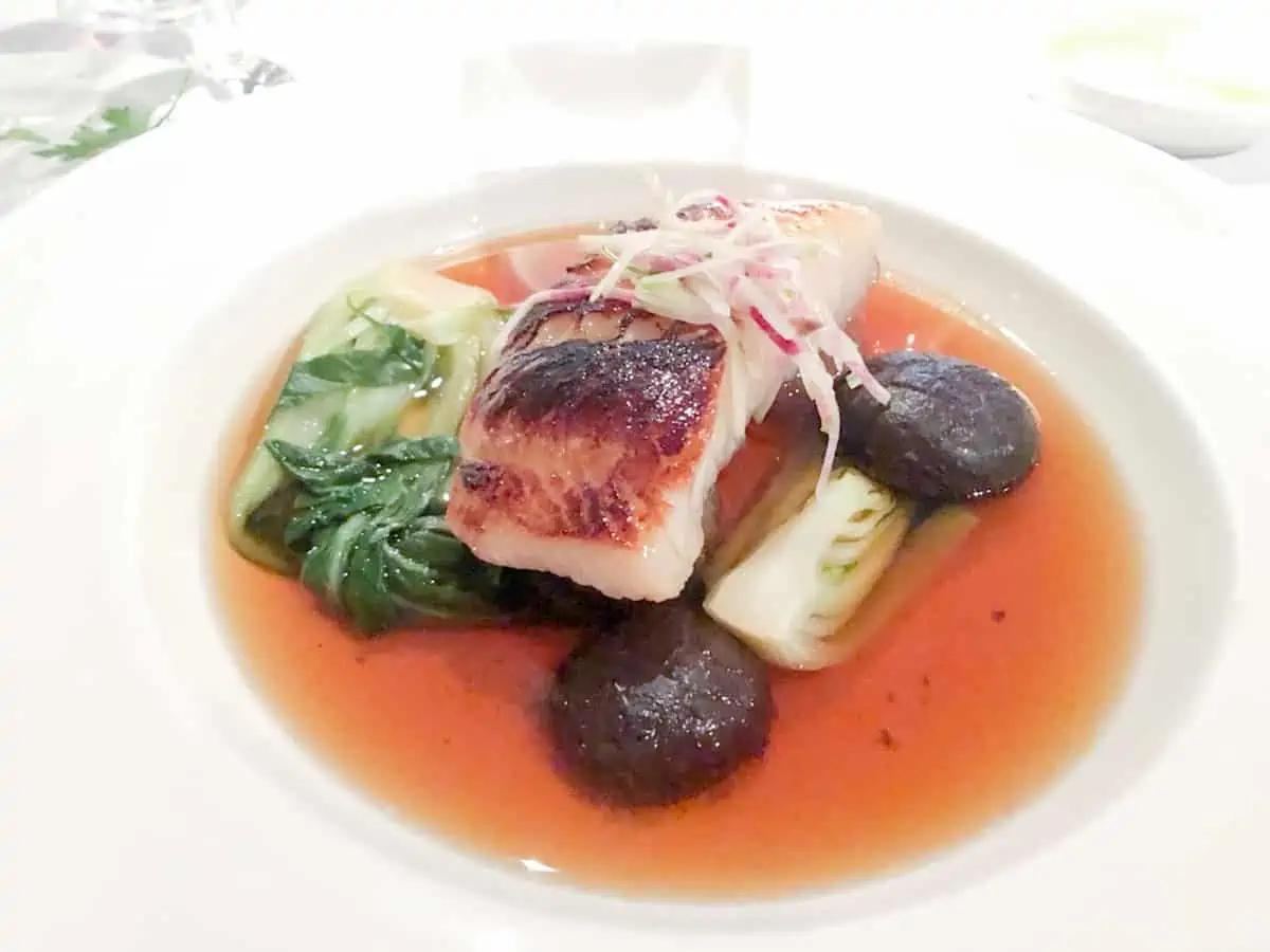 Sable fish on a white plate at Araxi in Whistler.