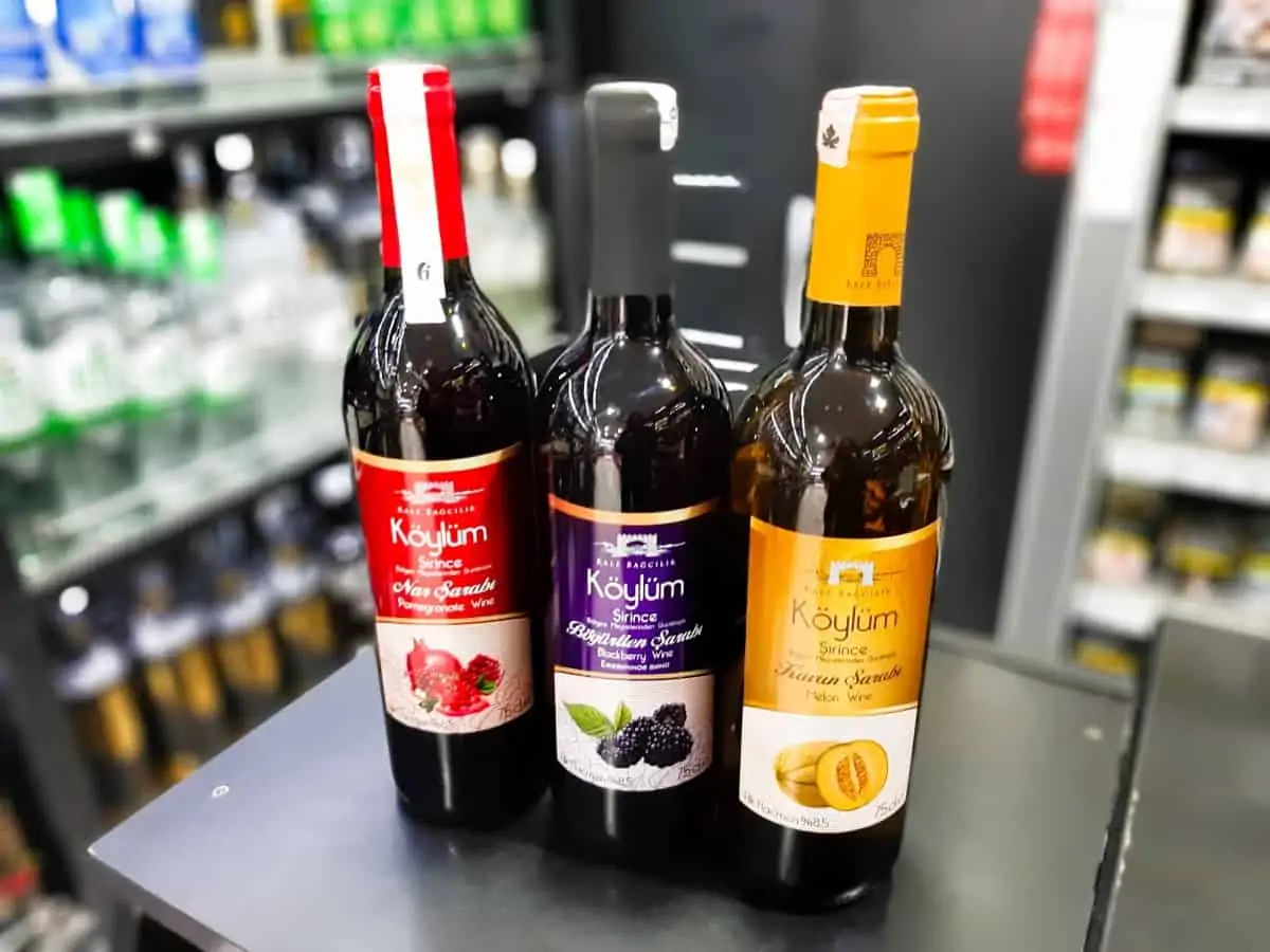 Traditional Turkish Drinks Sirince fruit wines in store on counter.