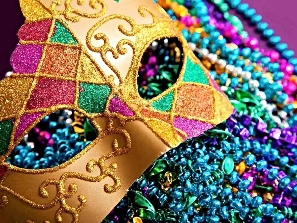 Mardi Gras mask and beads.