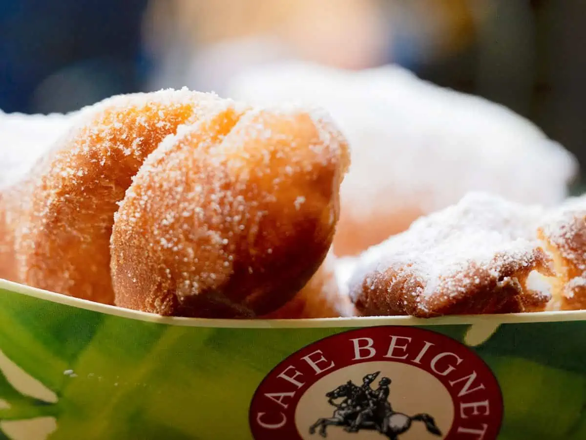 Pile of Beignets in container.