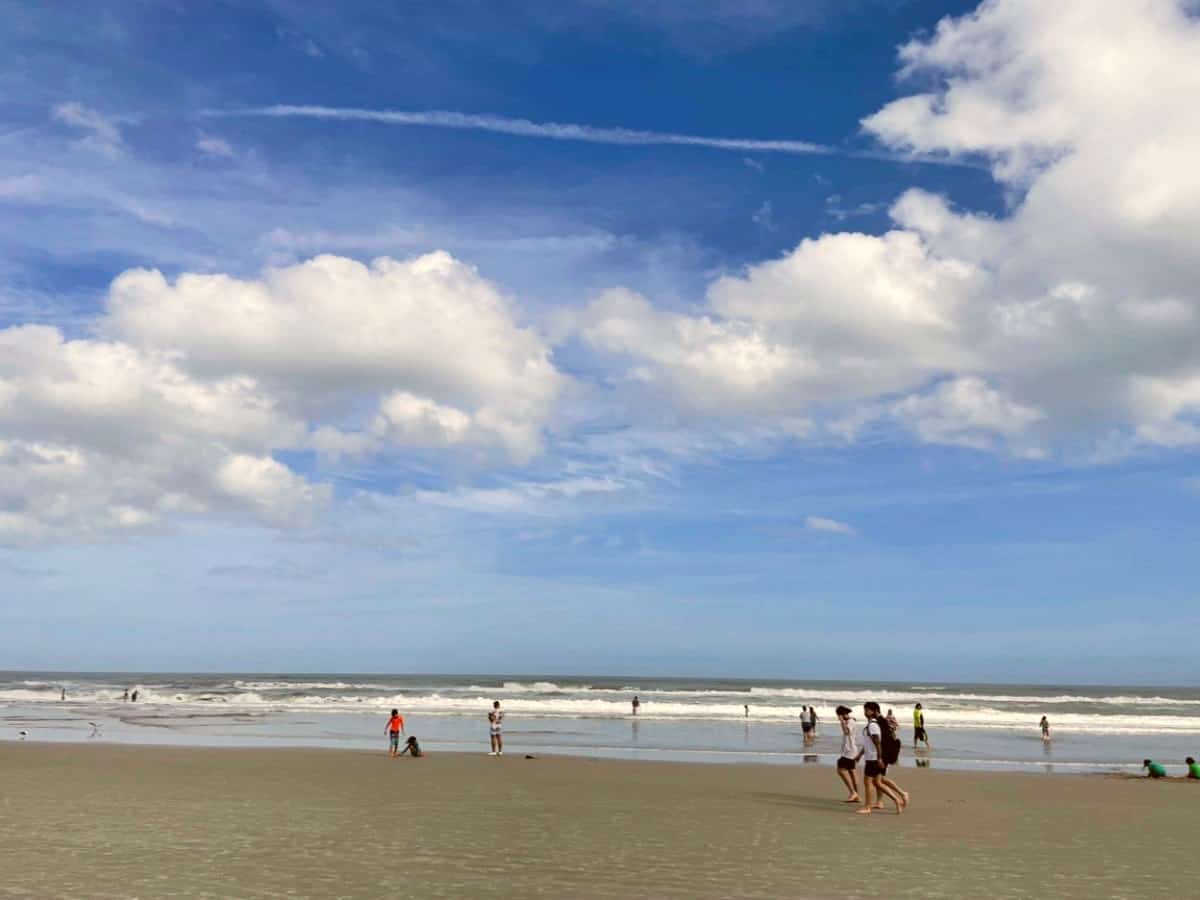 Beach and sky with tourist in Daytona Beach.
