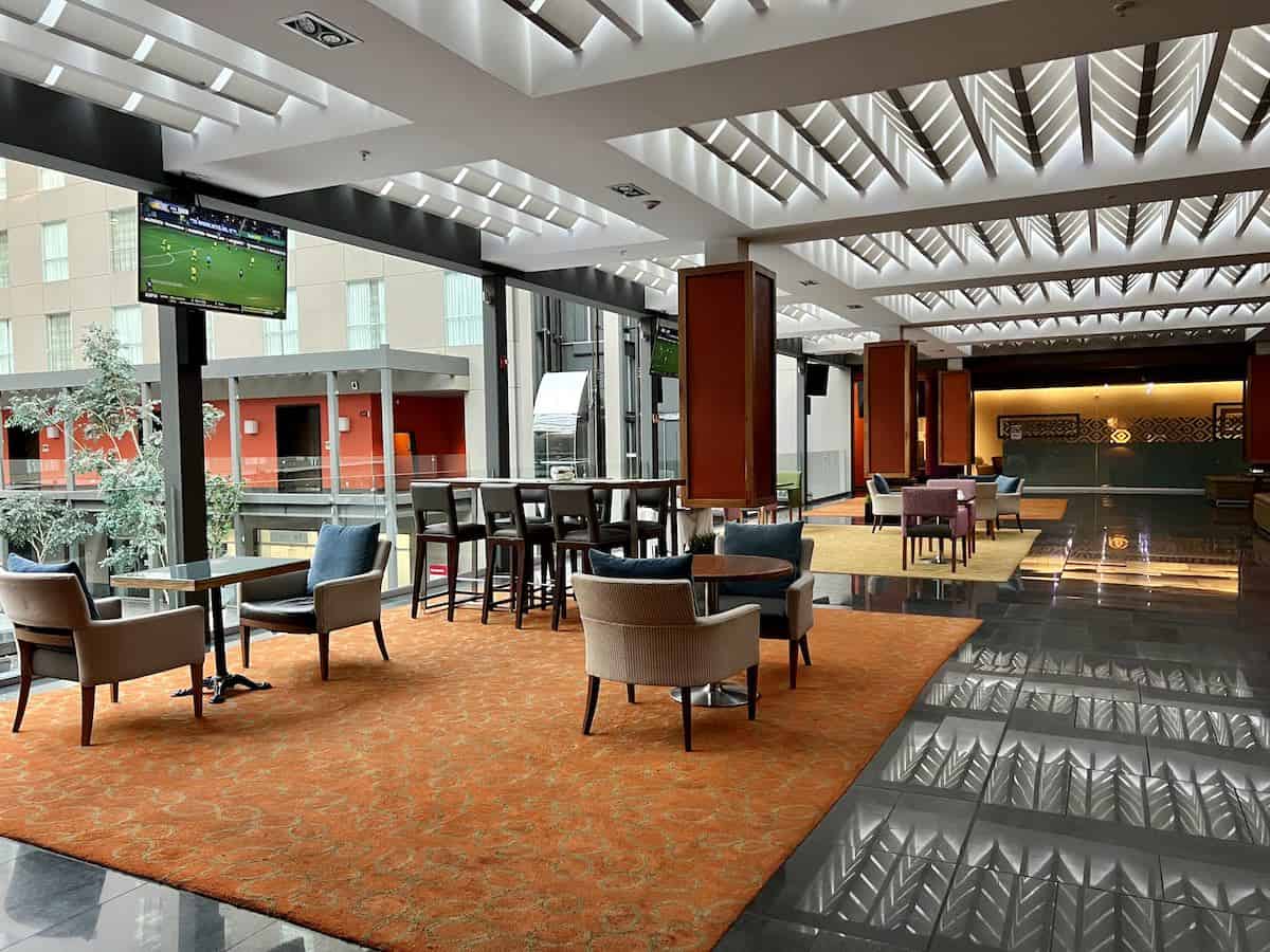 Interior lobby bar and restaurant area at the Courtyard by Marriott Mexico City Airport. 