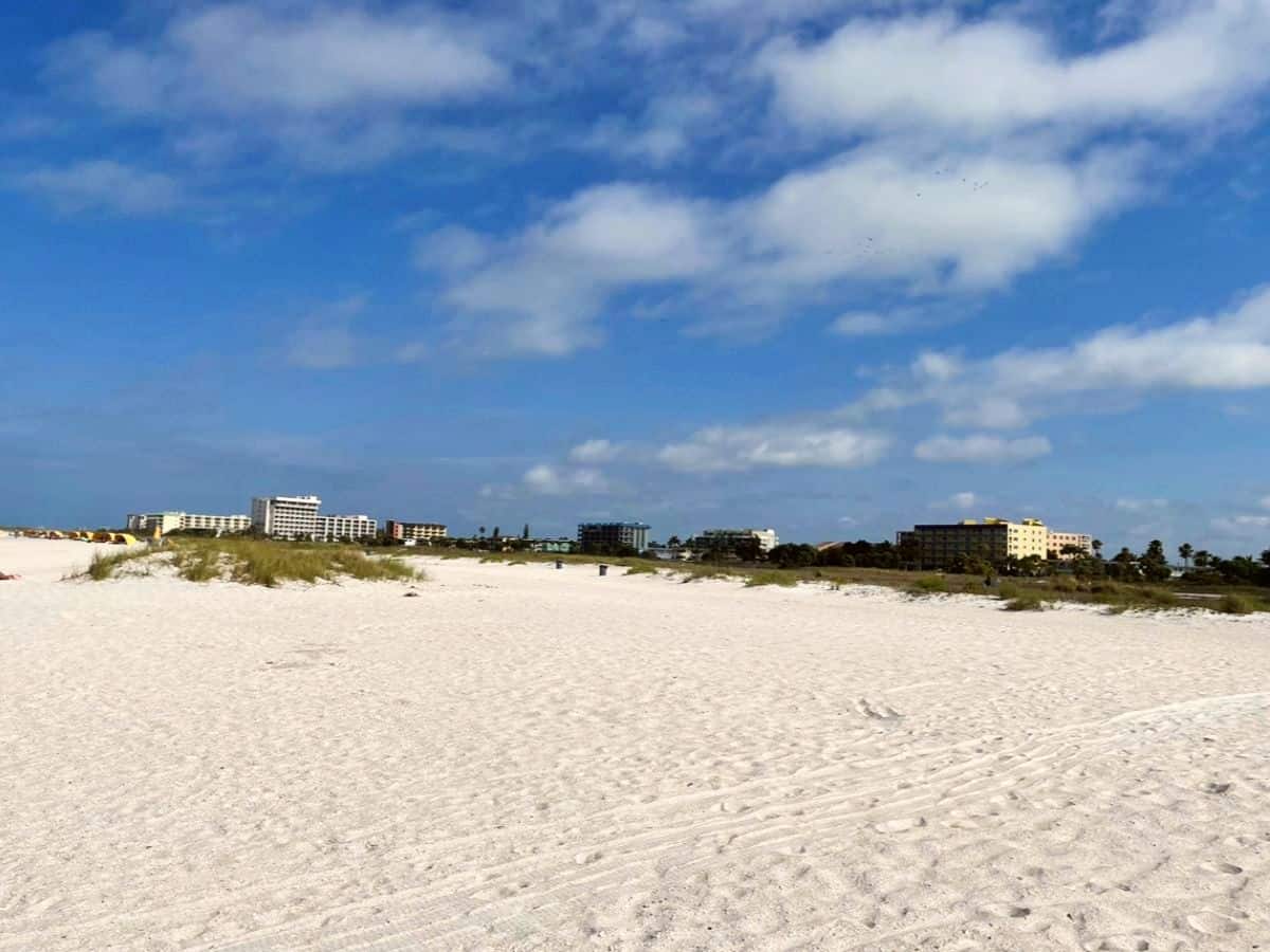 White sandy beach with condos on Treasure Island Beach. 