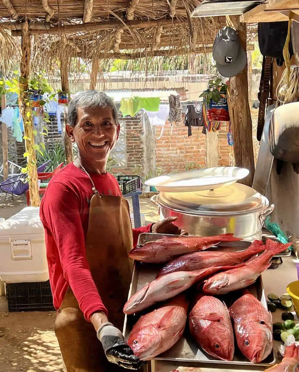 Chef/owner Silvino Armengol with fresh red snapper.