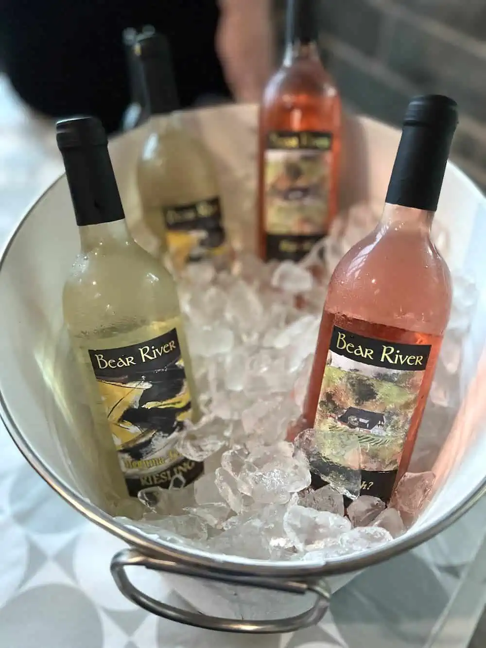 Bottles of Nova Scotia Bear River wines in an ice bucket. 