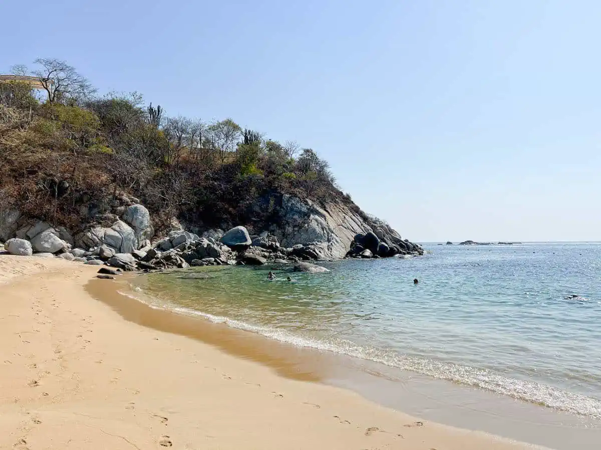 People swimming at Playa Arrocito in Huatulco, 