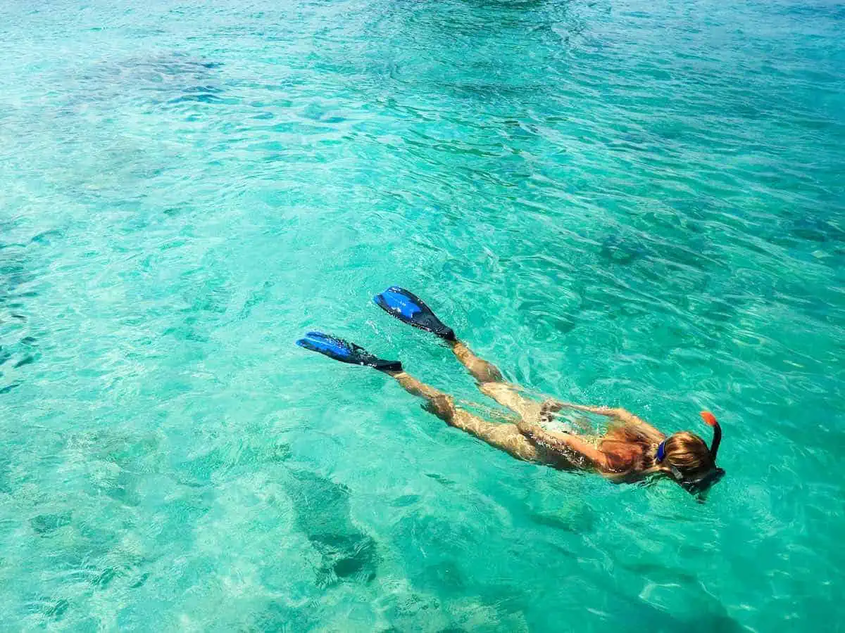 Young woman snorkeling.