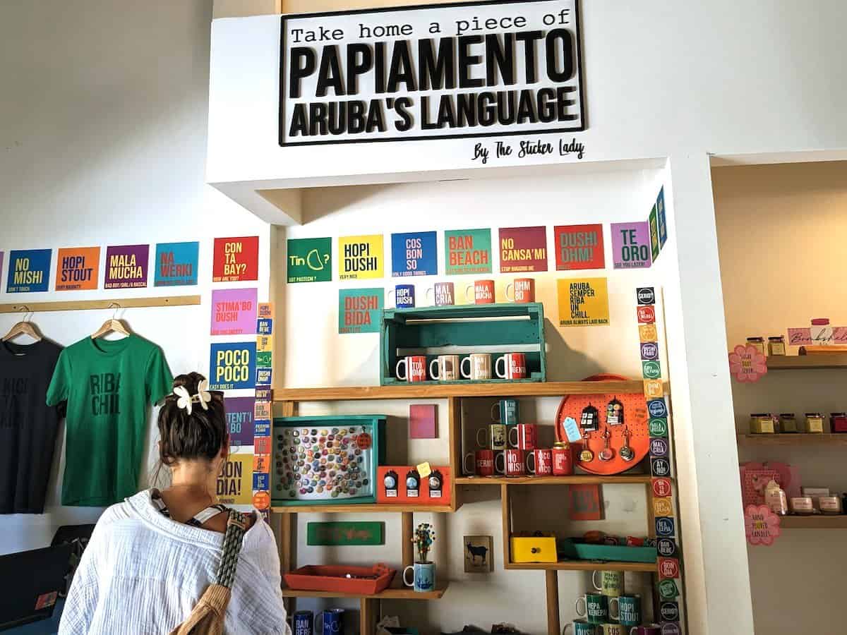 Young woman shopping for souvenirs at ArubaMade in Aruba.