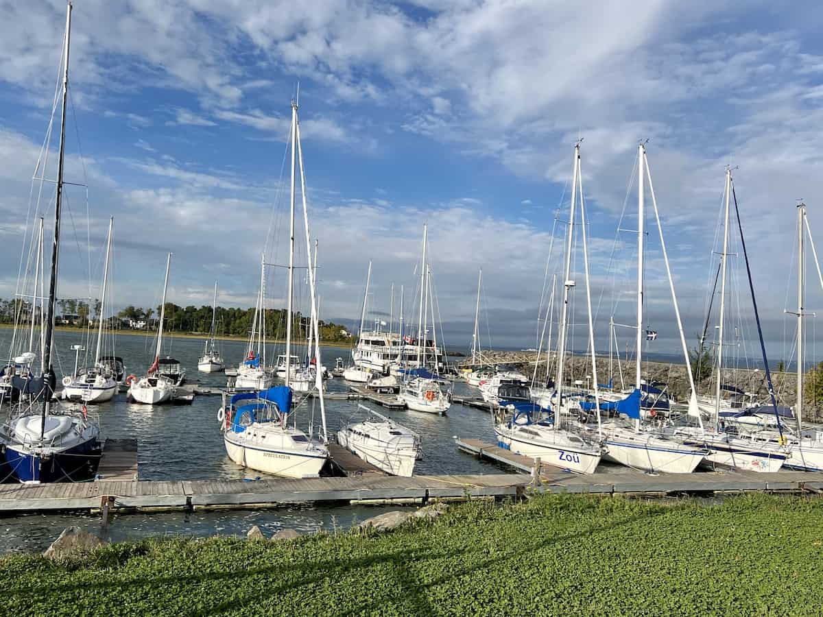 Boats in the water at Croisières Lachance marina on the St. Lawrence River. 