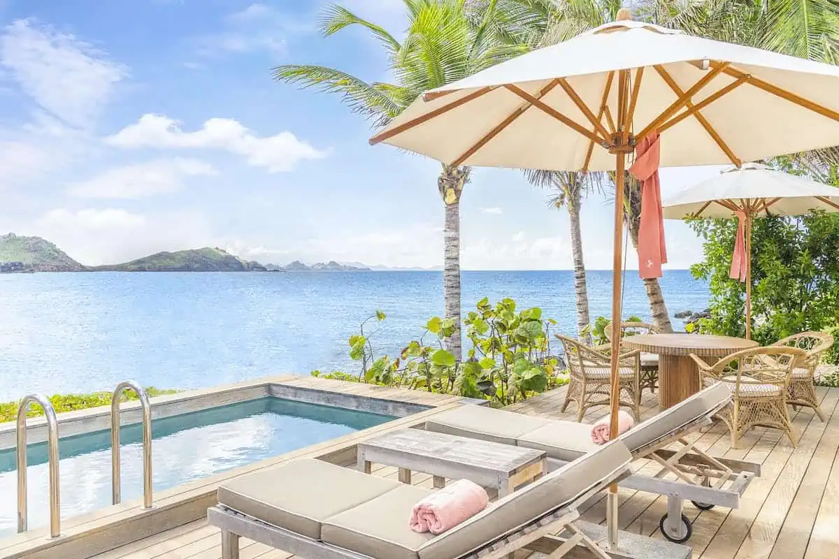 Lounge chairs with a view of the Caribbean at Cheval-Blanc Hotel in St. Barth. 