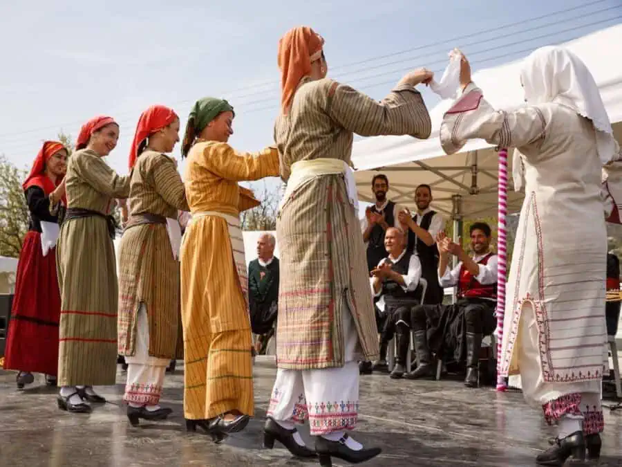 Dancers in traditional Cypriot clothing dancing.