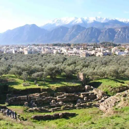 Ruins of ancient Sparta with Taygetus mountains in the distance.