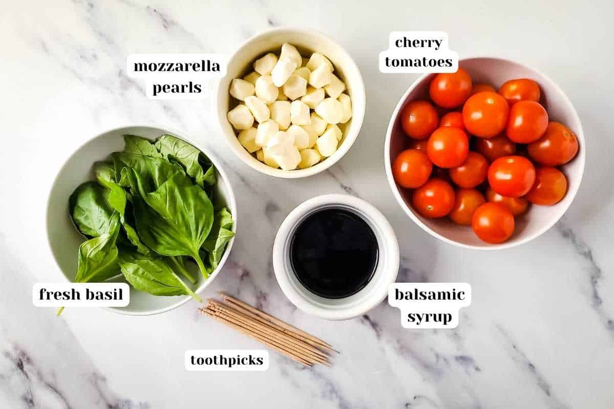Ingredients to make caprese skewers on the counter.