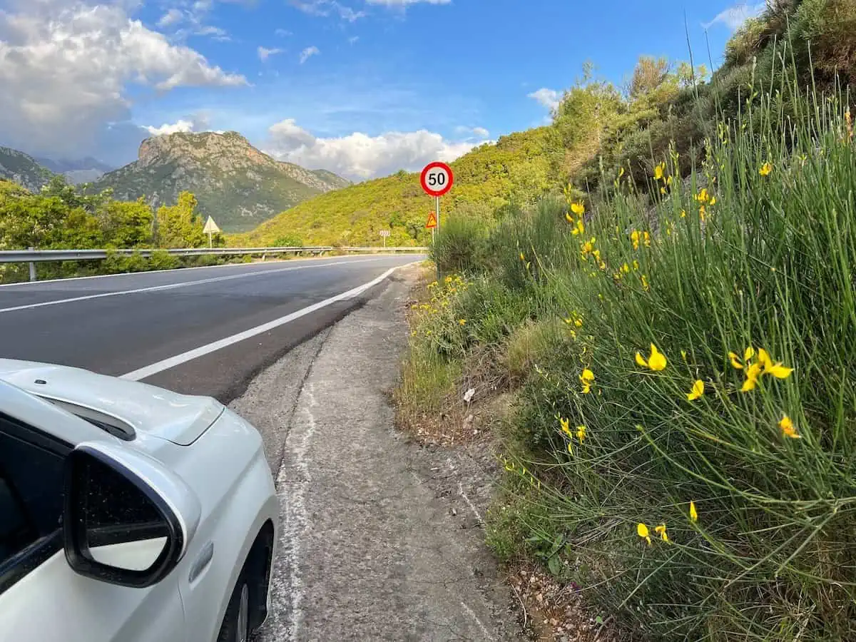 A rental car by the side of the road in Greece.   