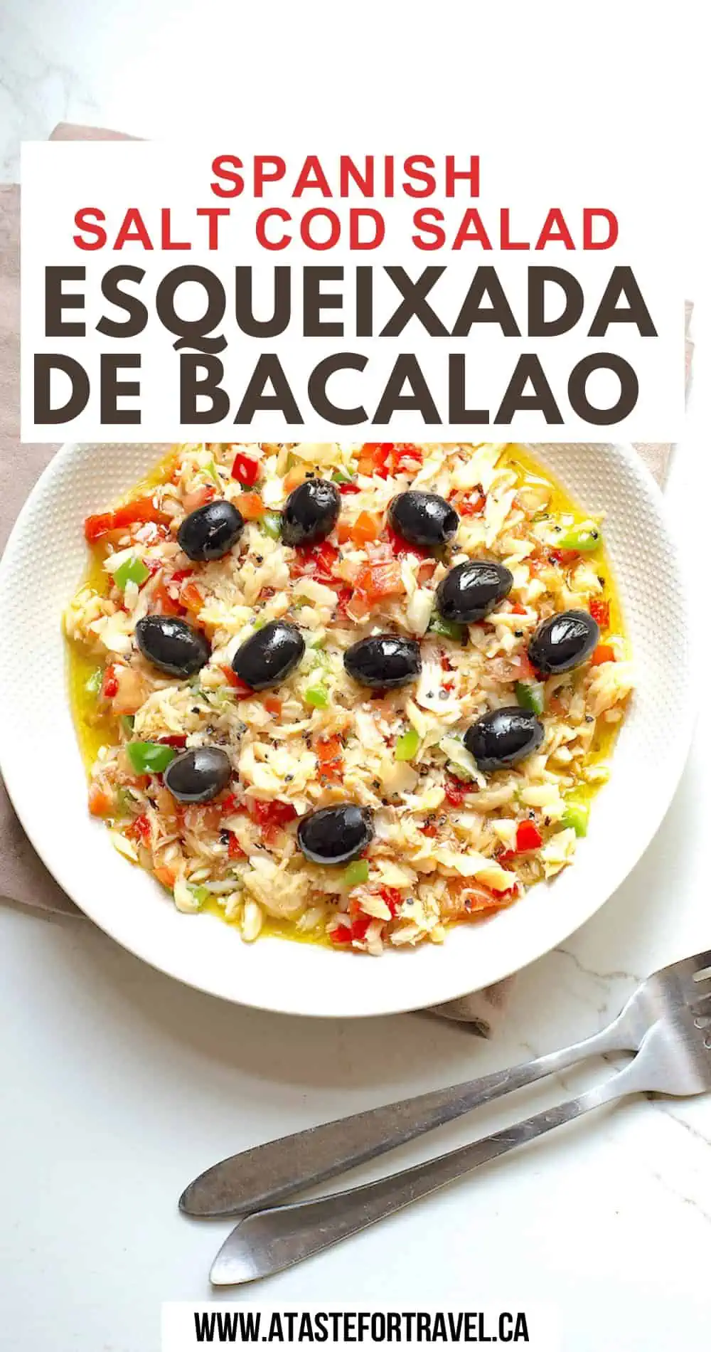 Overhead shot of Esqueixada de Bacalao in a white dish with forks on the side. 