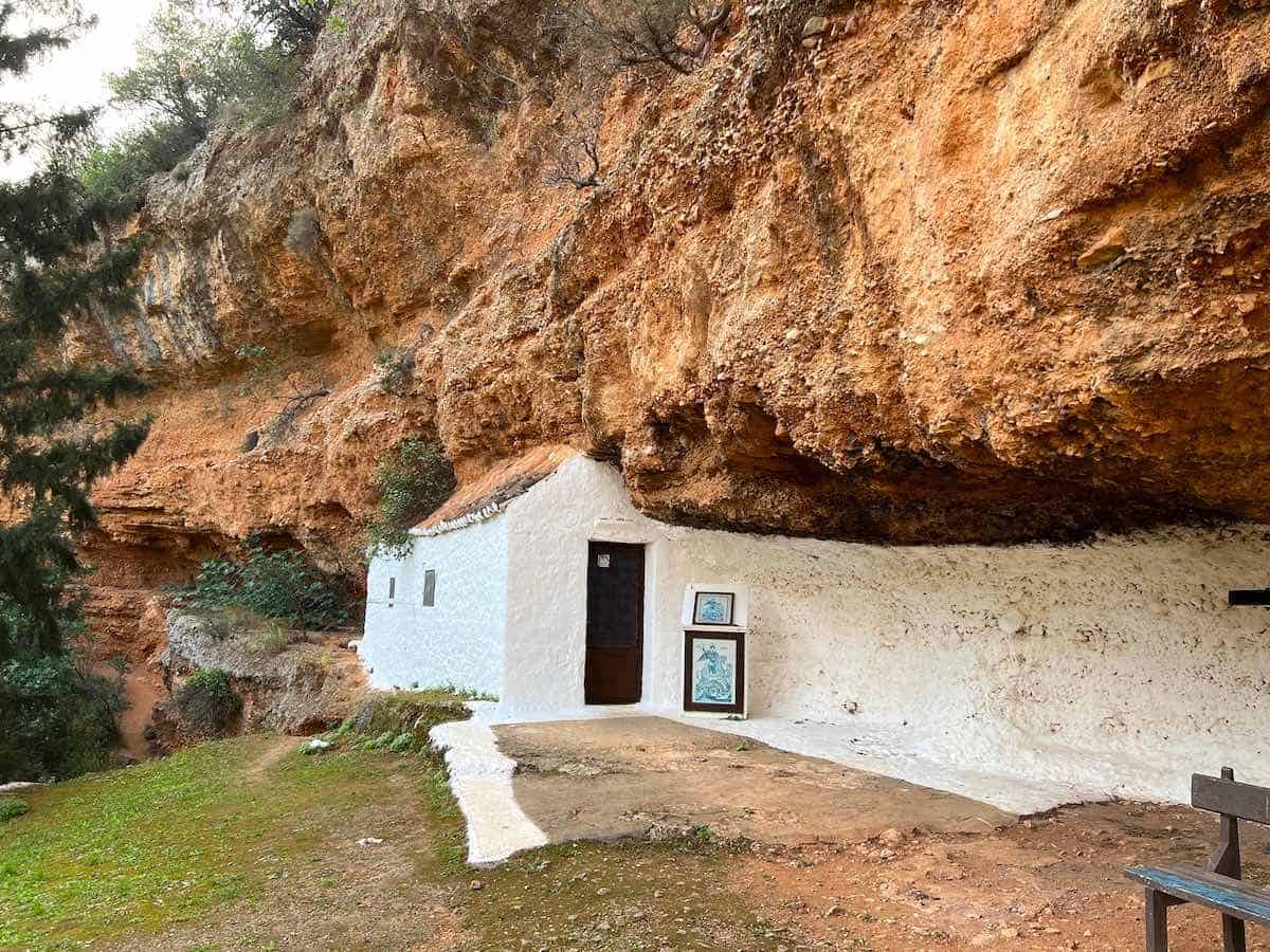 Rock church carved into walls of a crater. 
