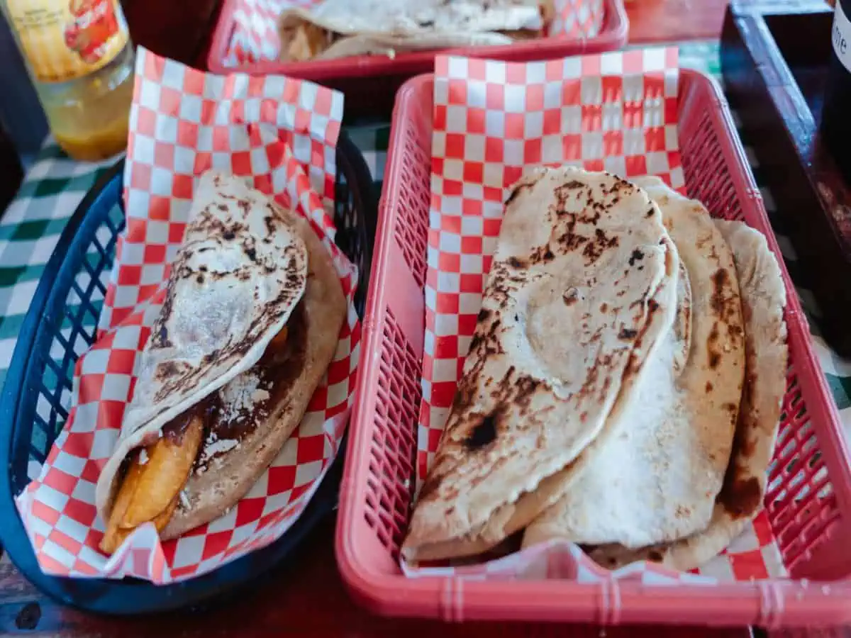 Baleadas in baskets on table.