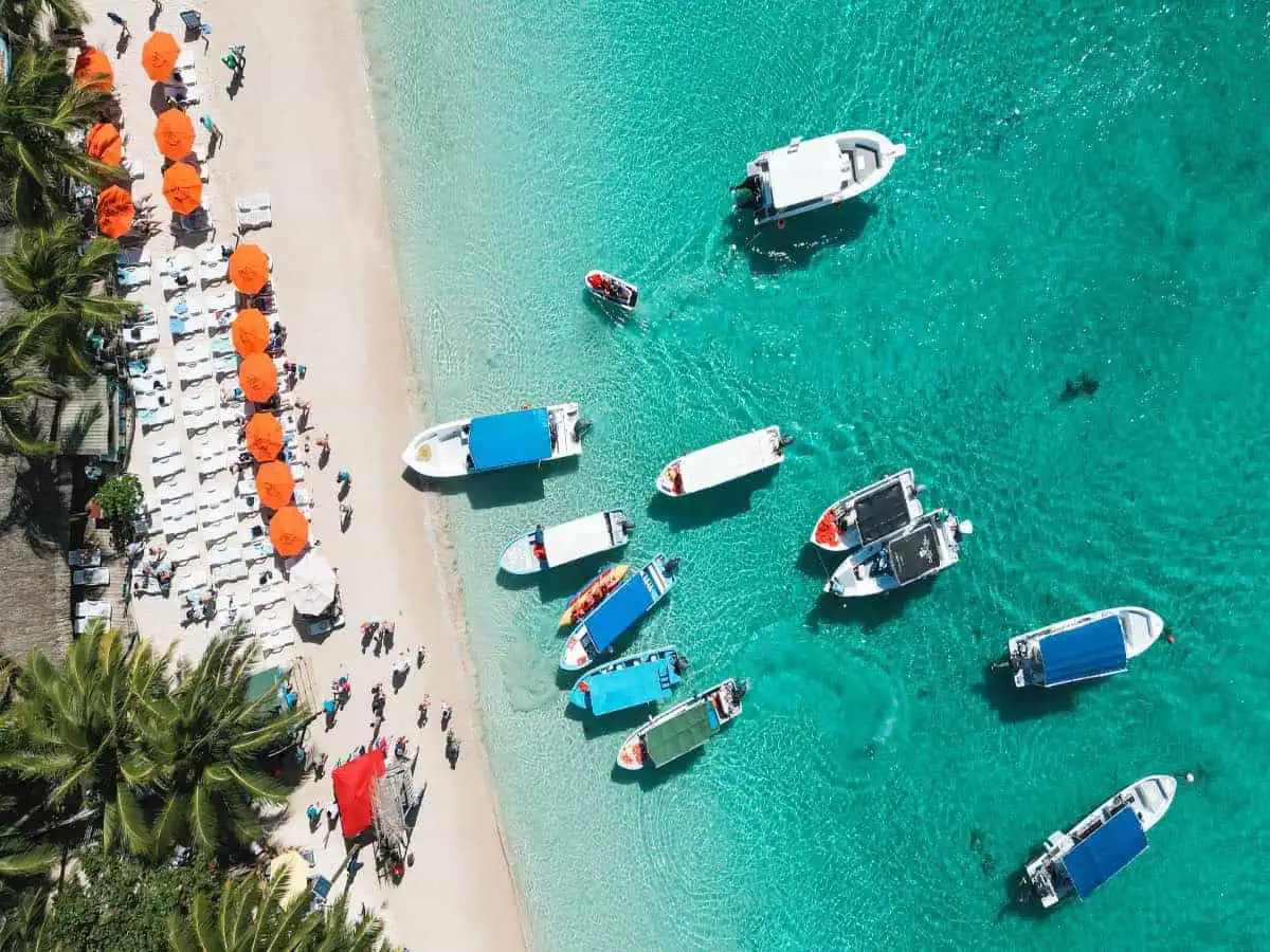 Aerial view of Caribbean beach with boats.